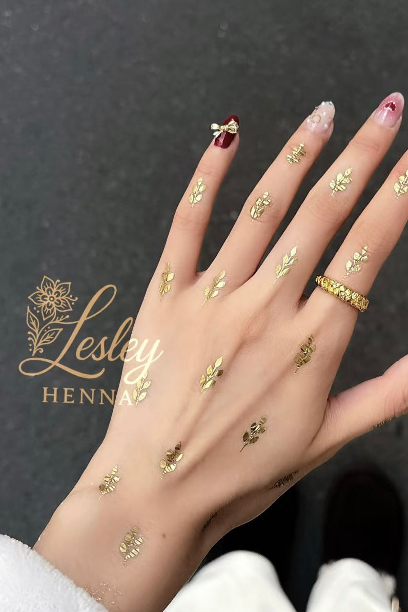 gold henna designs featuring the Lesley Henna logo.